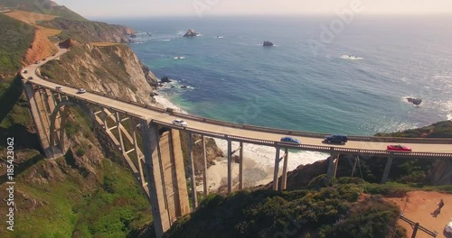 Aerial view cars passing Bixby Creek Bridge PCH Highway 1 in California