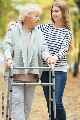 Young woman and her elderly...