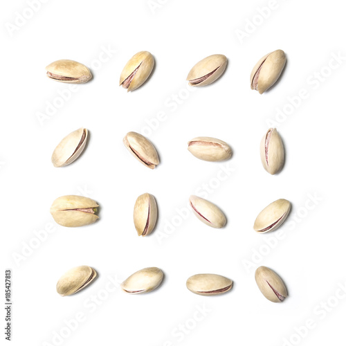 Roasted and salted pistachios isolated on white backround
