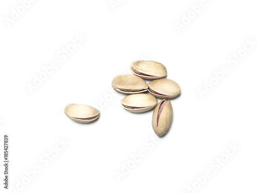 Roasted and salted pistachios isolated on white backround