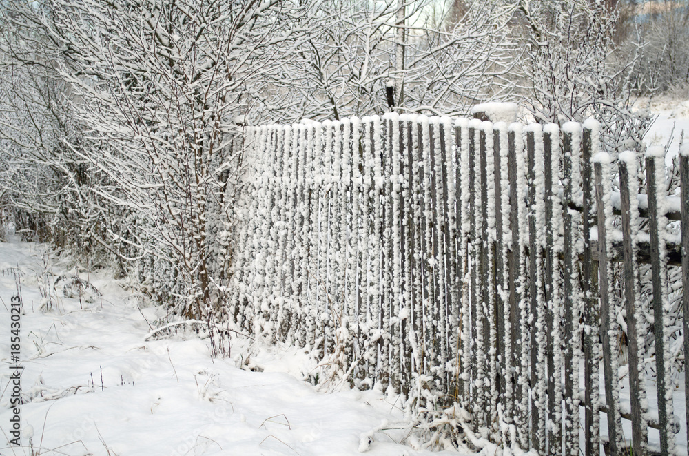 snow-covered wooden fence snow-covered wooden fence
