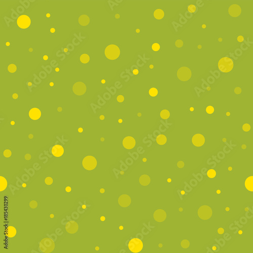 Yellow polka dots seamless pattern on green background. Good-looking classic yellow polka dots textile pattern in restrained colours. Seamless scattered confetti fall chaotic decor.