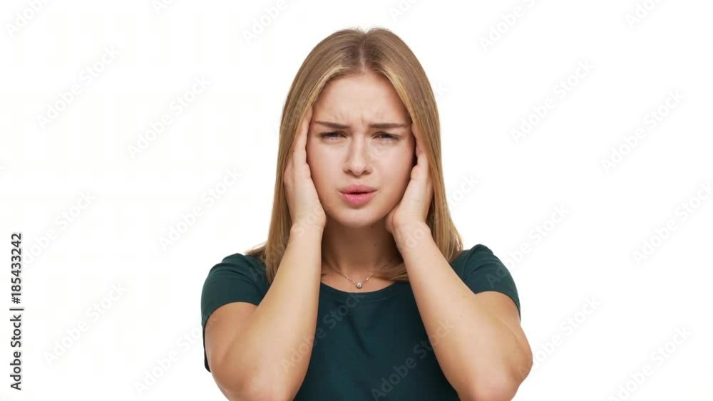 Horizontal portrait of tired woman 20s feeling sick massaging temples with fingers suffering from strong headache or migraine over white background. Concept of emotions Horizontal portrait of tired woman 20s feeling sick massaging temples with fingers suffering from strong headache or migraine over white background. Concept of emotions