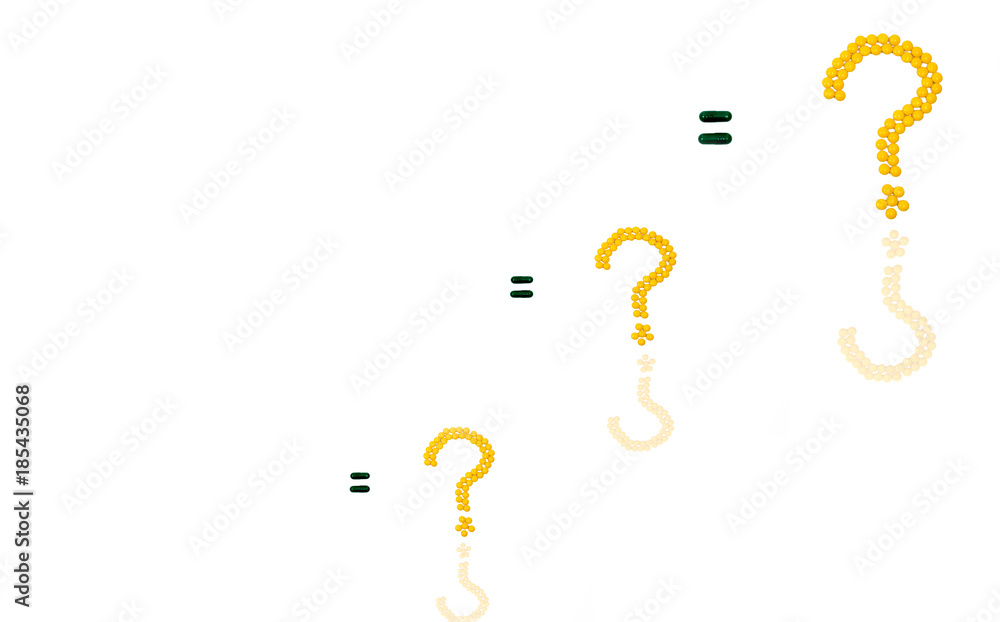 Three questions mark made of yellow sugar coated tablet pills. Equal sign made of capsule pills isolated on white background with copy space Three questions mark made of yellow sugar coated tablet pills. Equal sign made of capsule pills isolated on white background with copy space