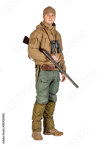 male hunter with double barreled shotgun