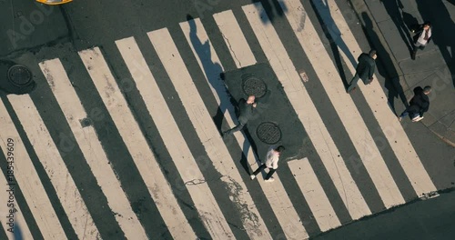 Overhead view above people crowd walking city street intersection zebra crossing