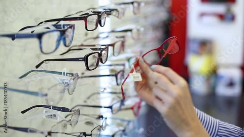 choosing eyeglasses in optics shop