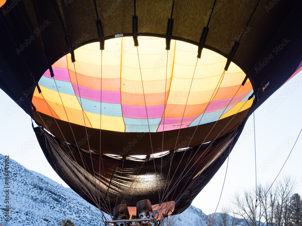 Fototapeta premium Hot air balloon illuminated by sunlight at Winthrop Balloon Festival in Washington state