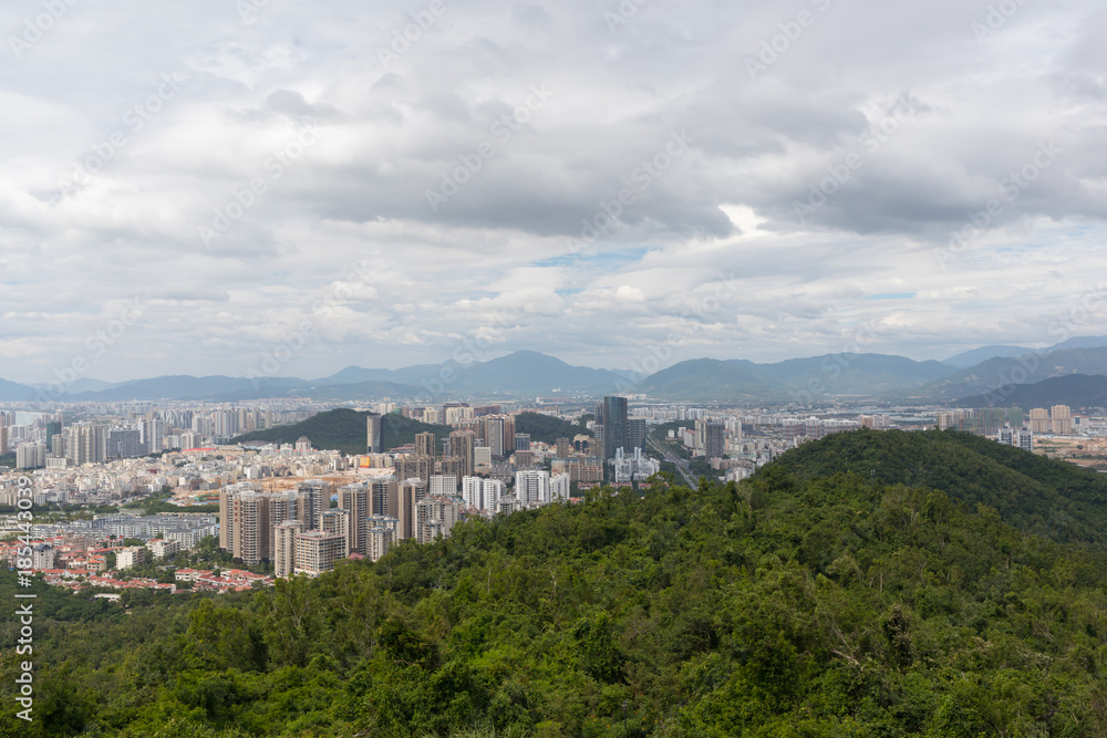 View on the modern city of Sanya and the hills of the tropical park from the observation deck in Lingchunling Forest Park in Hainan Island in China