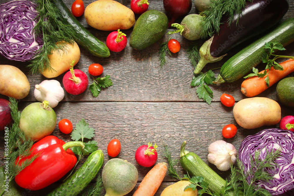 Assortment of vegetables pepper, baclaran, tomatoes, zucchini, carrots on wooden boards Assortment of vegetables pepper, baclaran, tomatoes, zucchini, carrots on wooden boards
