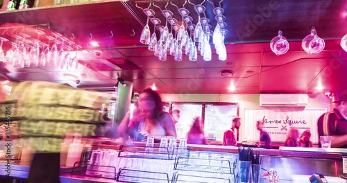 WHITSUNDAY ISLANDS – FEBRUARY 2016 : Timelapse of local bar interior on Airlie Beach at night from behind the bar with people in view