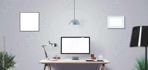 Computer display and office tools on desk. Desktop computer screen isolated. Modern creative workspace background. Front view.