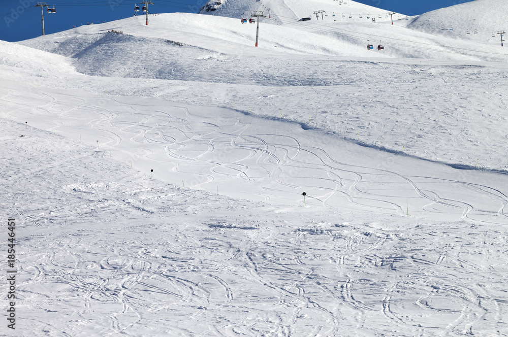 Snowy ski slope at nice sun day