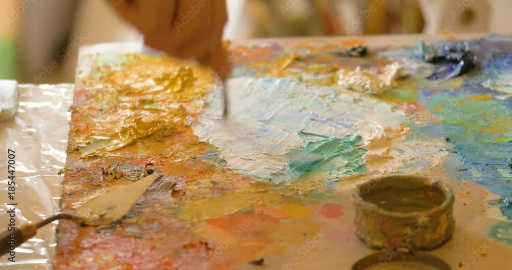 An artist is painting the picture. An artist is painting the picture.