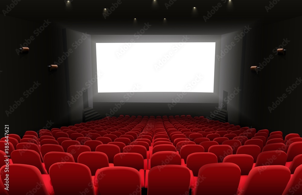 Cinema auditorium with red seats and white blank screen