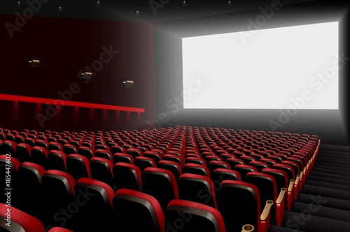 Cinema auditorium with red seats and white blank screen