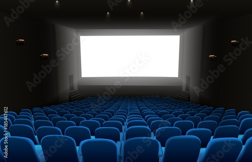 Cinema auditorium with blue seats and white blank screen
