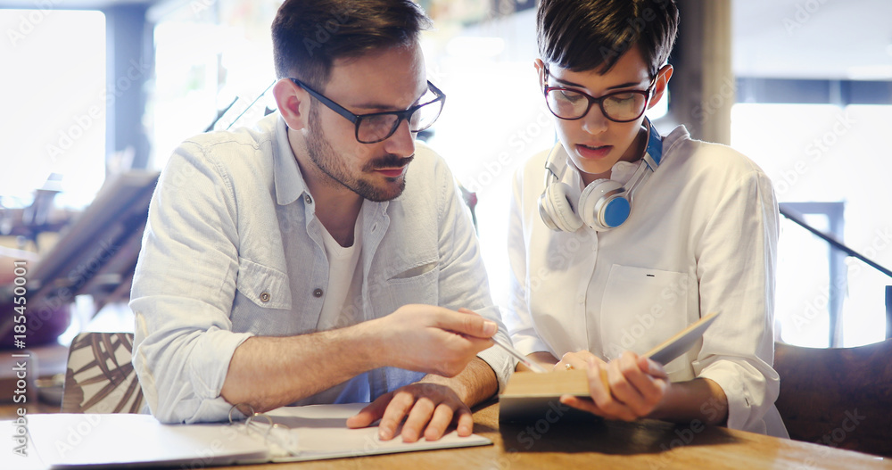 Obraz premium Students couple in school studying for exams together