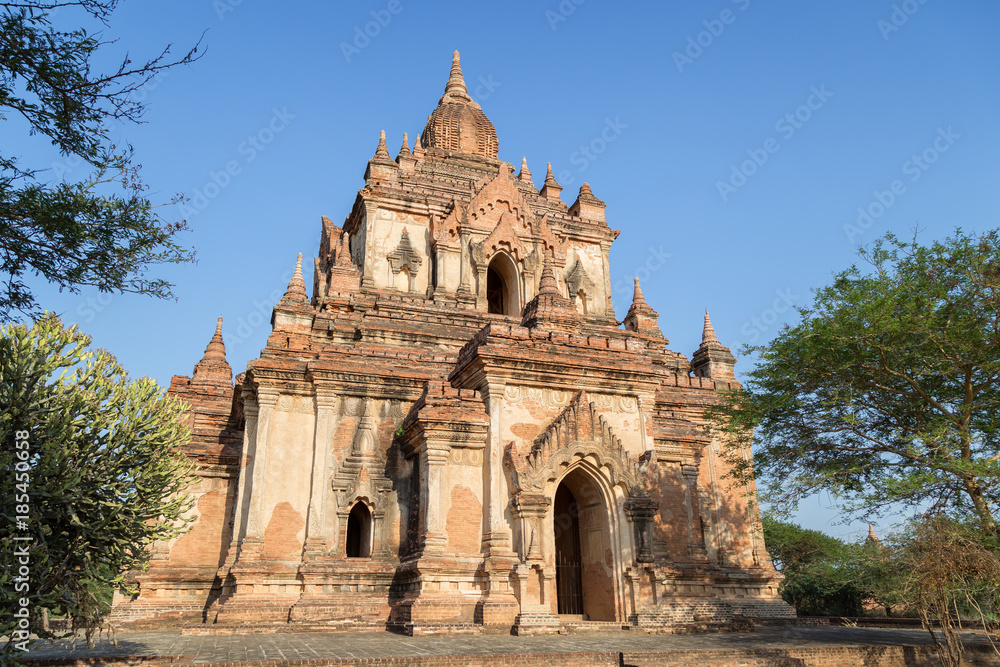 Ancient Tha Beik Hmauk Gu Hpaya in Bagan, Myanmar (Burma), on a sunny day.