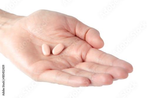 pills in woman hand