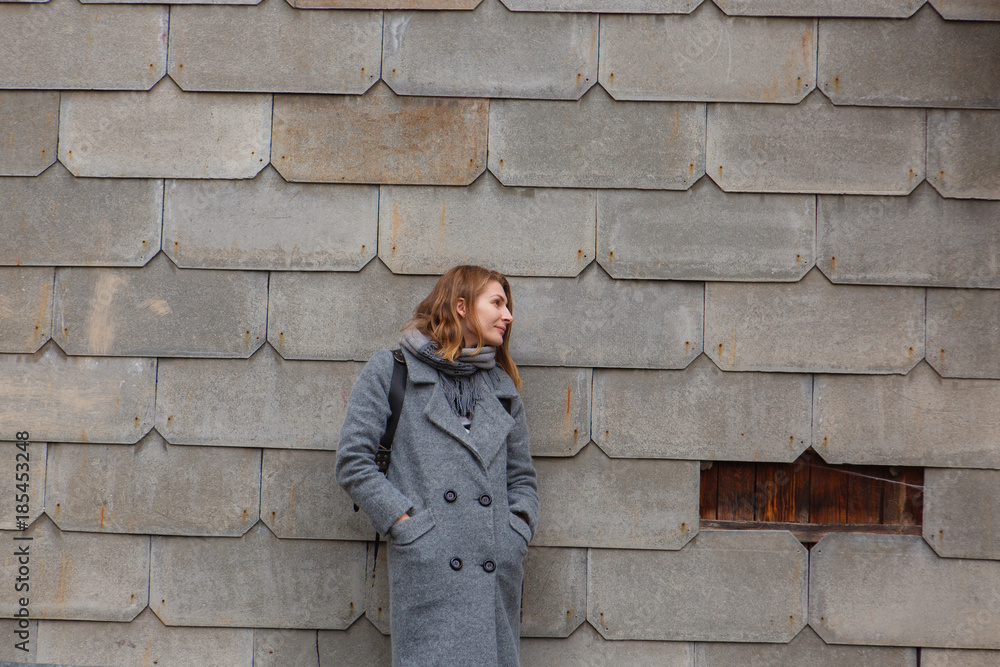 Young tender woman on gray brick background. Rusty wall Young tender woman on gray brick background. Rusty wall