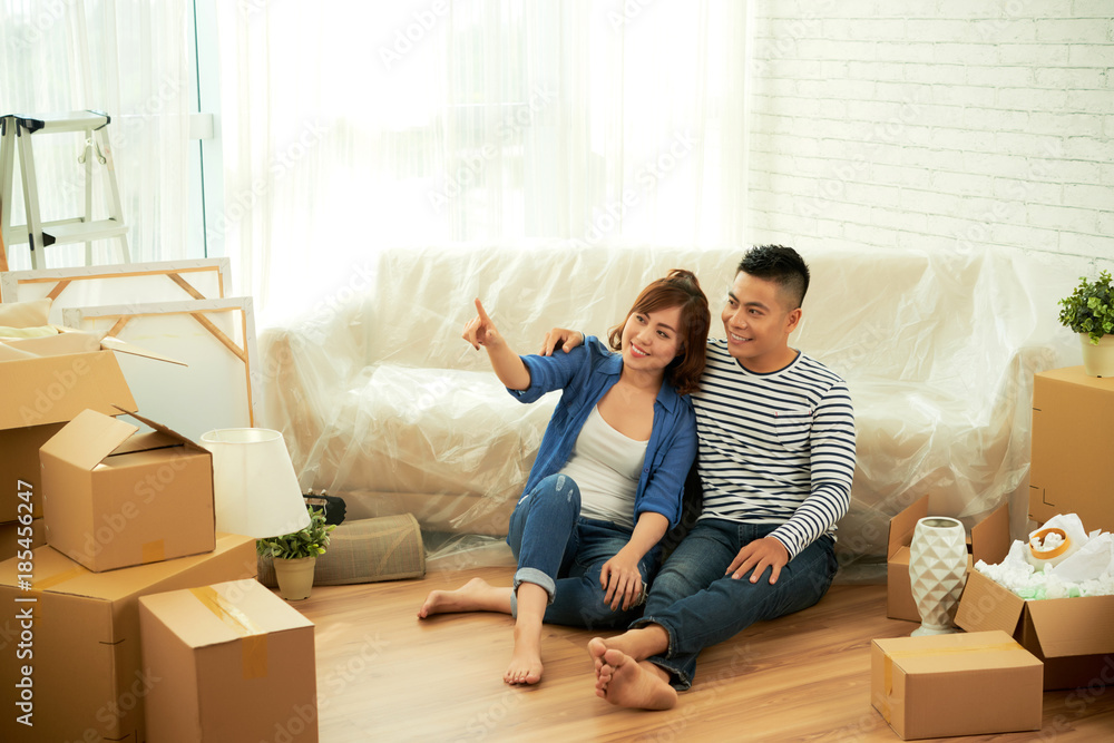 Young couple in their new home Young couple in their new home