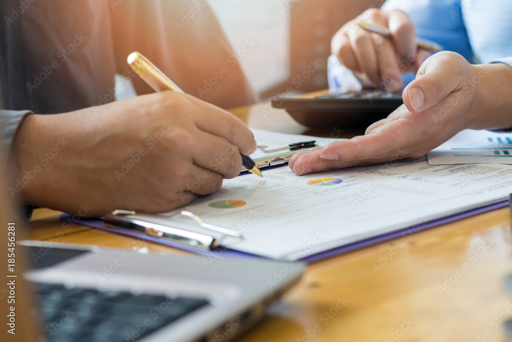 male hand pointing at business document male hand pointing at business document