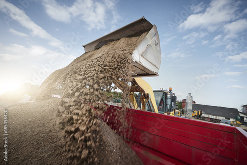 Excavator moving sand and gravel 
