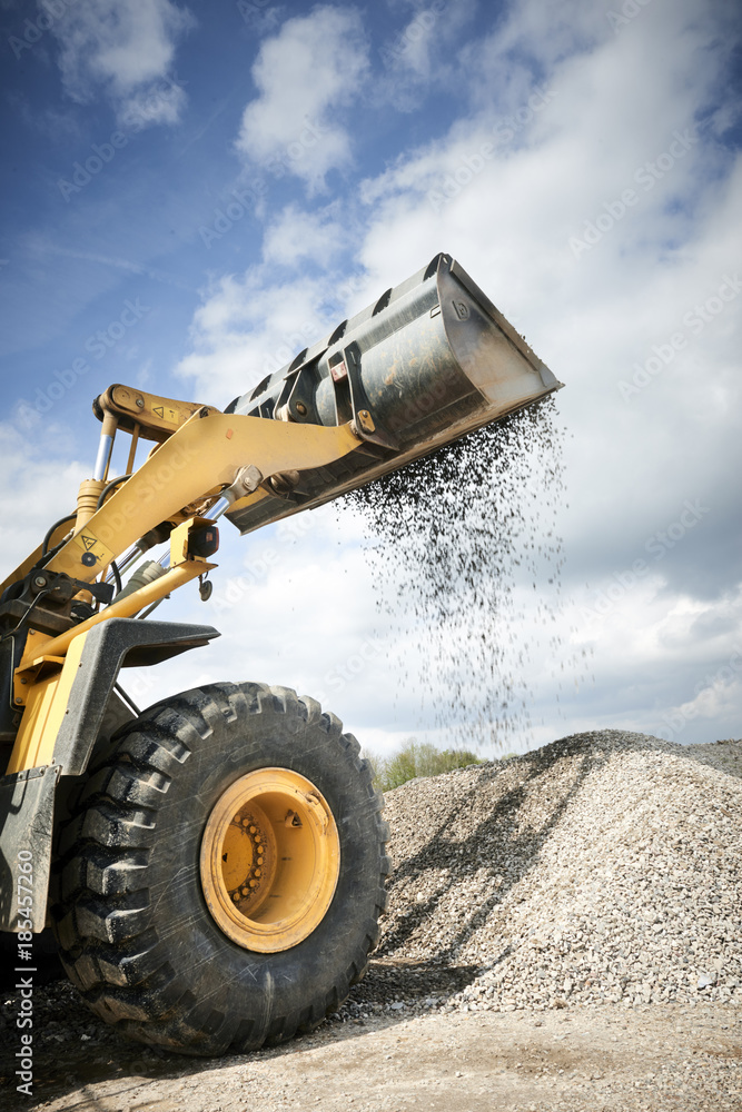 Fototapeta premium Excavator moving sand