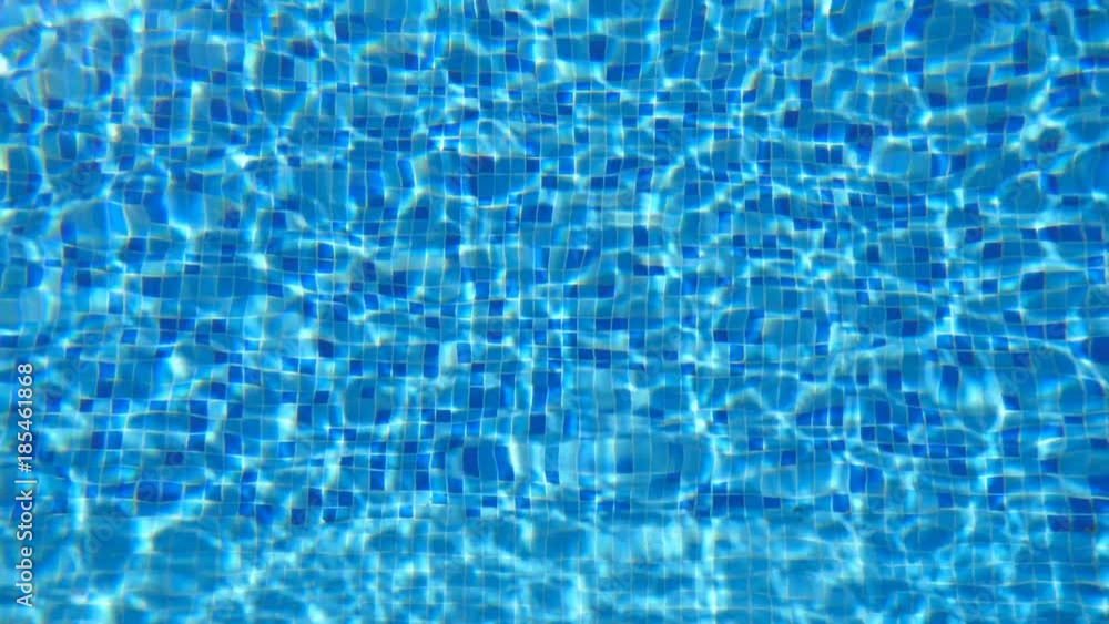 Blue water in pool. Beautiful background. Slow motion Close up Blue water in pool. Beautiful background. Slow motion Close up