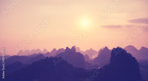 Color toned scenic sunset over Karst mountains in Guilin, China.