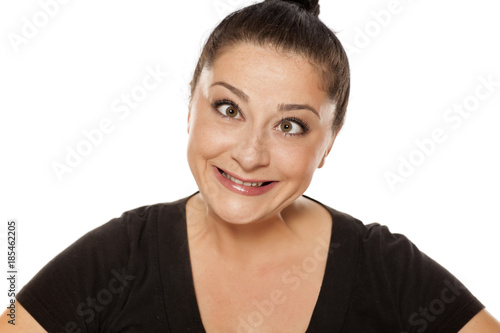 funny chubby woman making face on white background