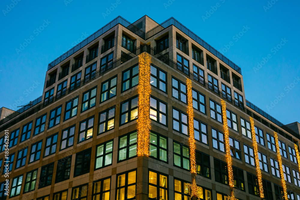 office building with christmas lights on the facade