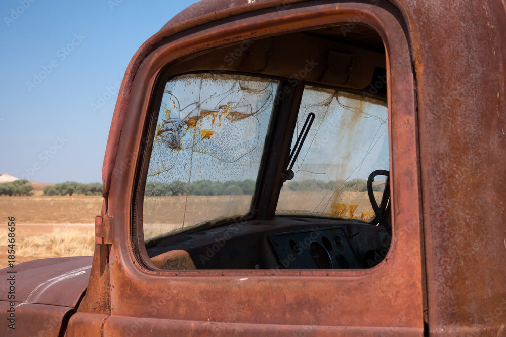 Rusty truck door and windows in outback Queensland