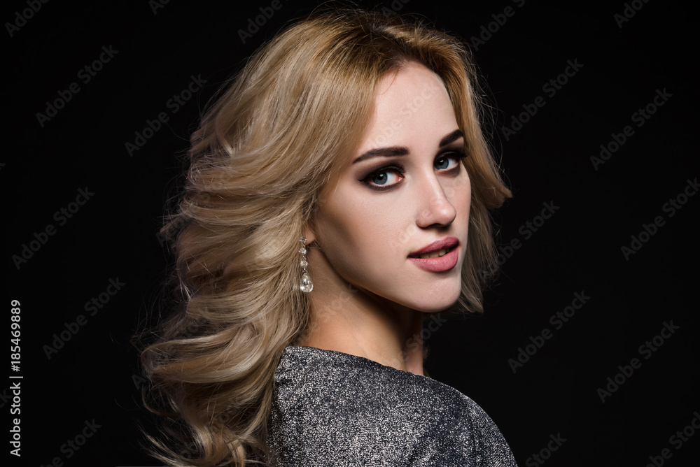 Studio beauty portrait of gorgeous blonde woman on black background Studio beauty portrait of gorgeous blonde woman on black background