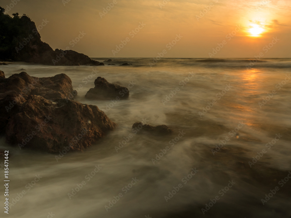 strong wave and sunset at the beach strong wave and sunset at the beach