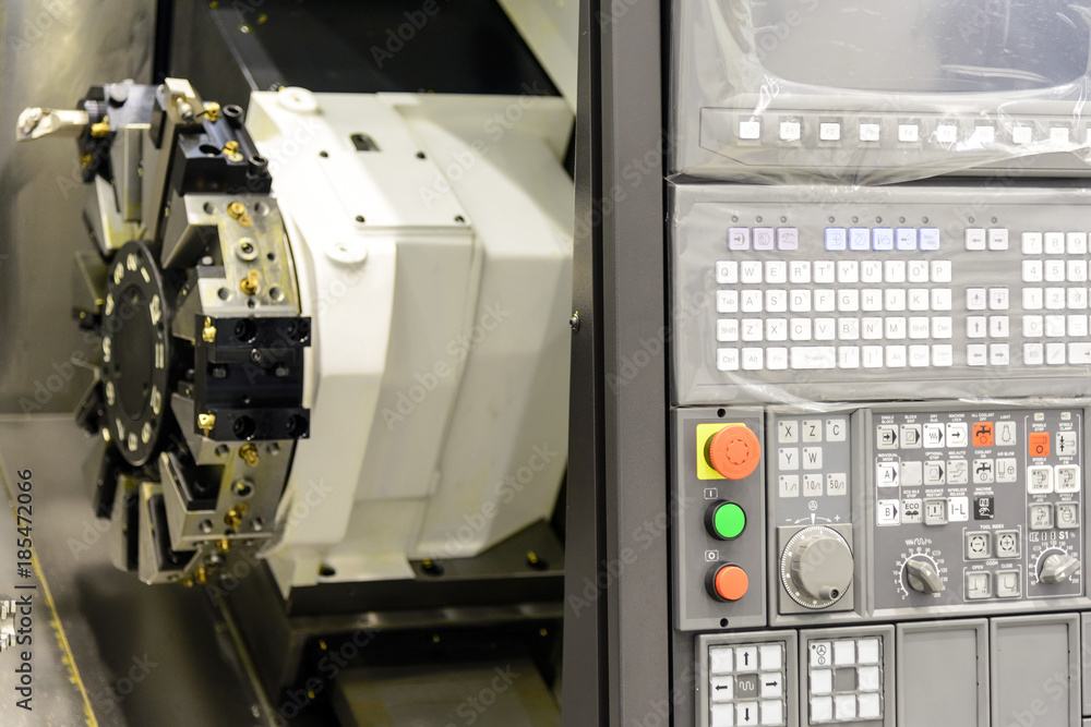 Close up of the CNC lathe panel .CNC lathe or CNC turning machine. Hi-precision CNC machining concept. Close up of the CNC lathe panel .CNC lathe or CNC turning machine. Hi-precision CNC machining concept.