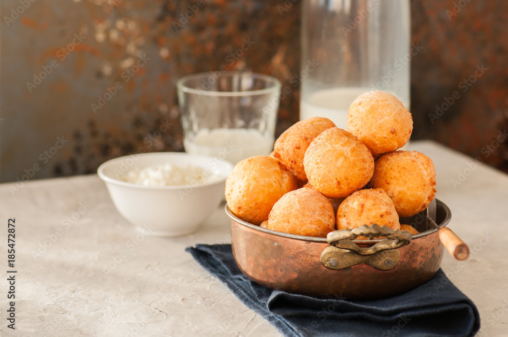 Small cottage cheese doughnuts (castgnole) served in a vintage bowl. Festive dessert.
