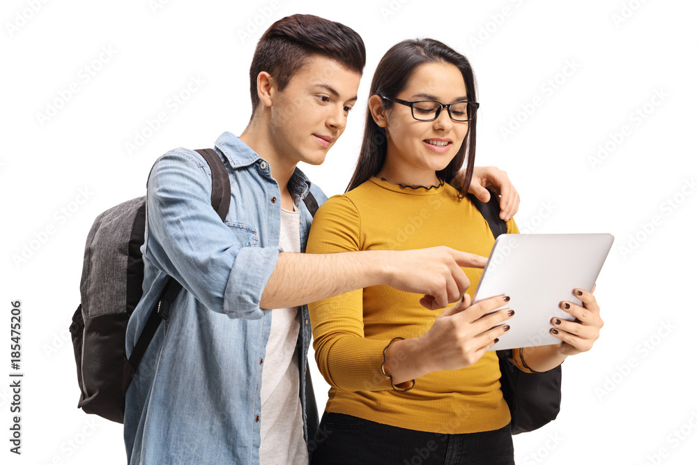 Teenage students looking at a tablet Teenage students looking at a tablet