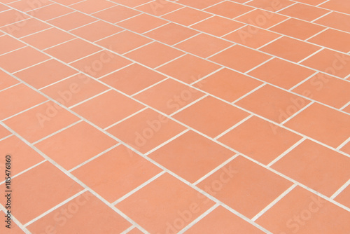 Ceramic tiled floor Red brick wall texture background.