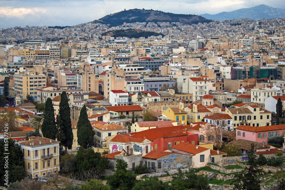 Athens city partial view with Plaka neighborhood in the foreground.
