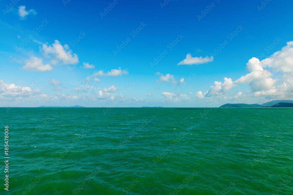 Seascape with green islands on horizon