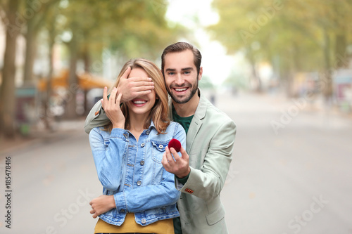 Young man with engagement r...