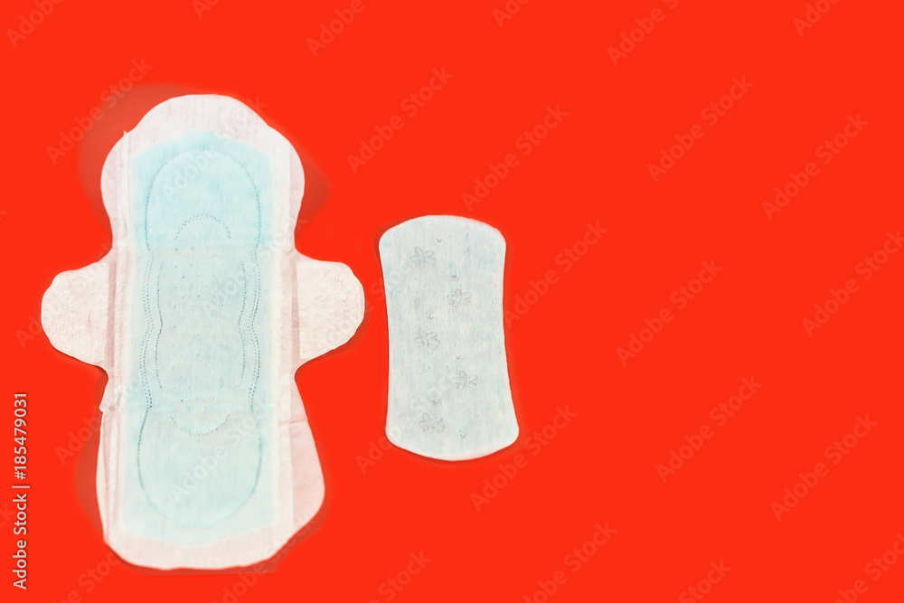 Sanitary pads and absorbent sheets on a red background Sanitary pads and absorbent sheets on a red background