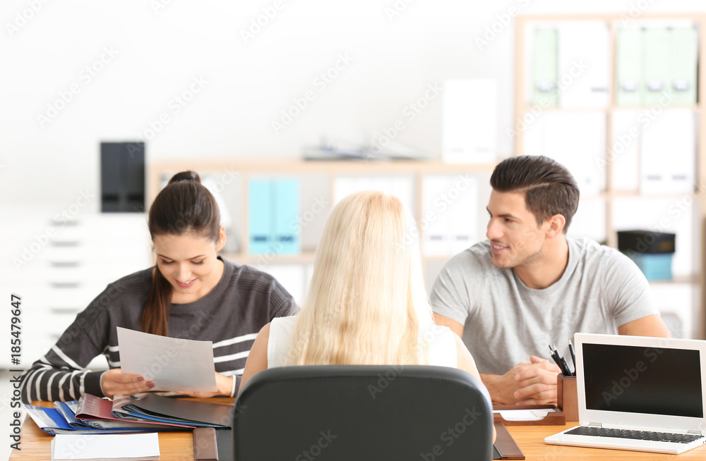 Young couple at notary public office Young couple at notary public office
