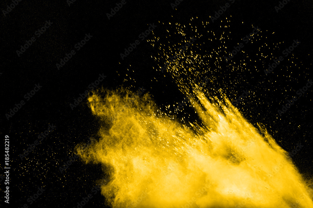 abstract yellow dust explosion on black background. abstract yellow