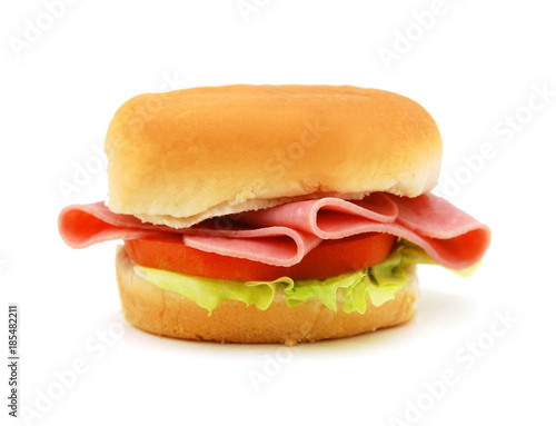 Sandwich with honey ham, swiss cheese, lettuce and tomatoes isolated on white