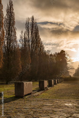 Steinquader auf dem Heidelberger Ehrenfriedhof im dramatischen Licht der frühen Morgensonne photo