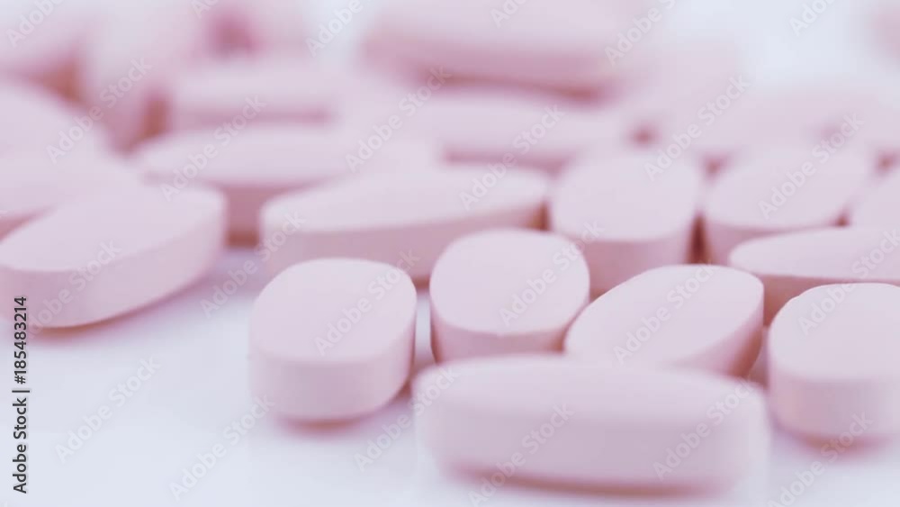 Oval pink tablets on plate