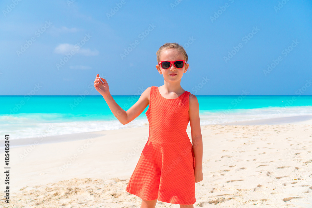 Adorable little girl at beach during summer vacation Adorable little girl at beach during summer vacation